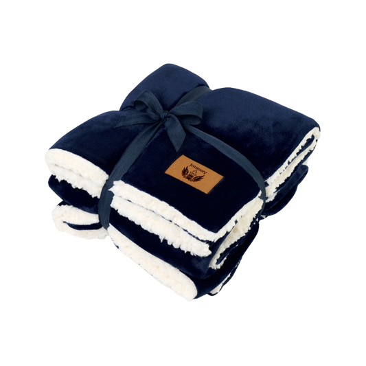 Navy blue and white blanket with a brand label on a white background