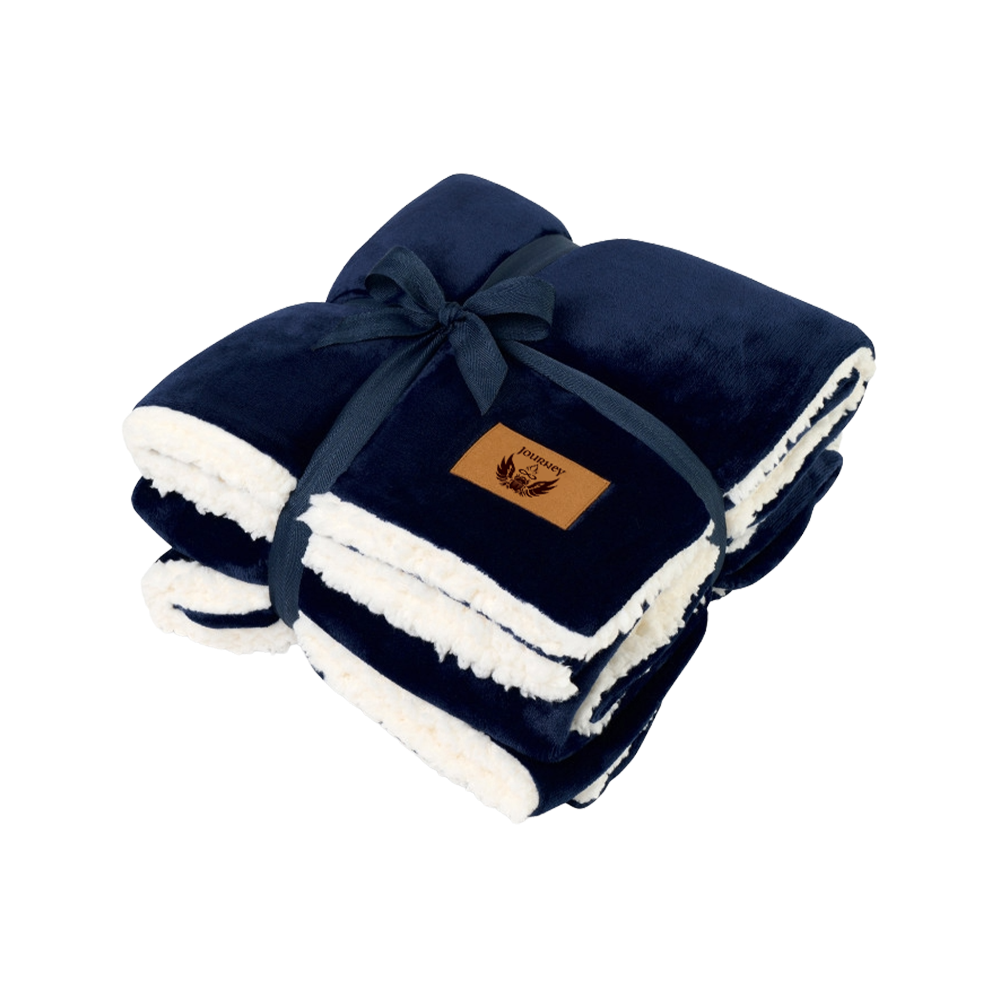 Navy blue and white blanket with a brand label on a white background
